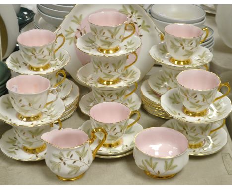 A Royal Albert Braemar pattern tea service comprising thirteen tea plates, cake plate, thirteen saucers and twelve cups, milk