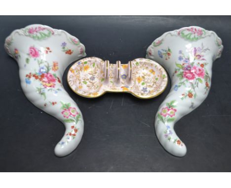 A Royal Worcester miniature toast rack decorated with butterflies and flowers, cream ground, by Aspreys circa. 1328; a pair o