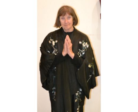 A vintage mid 20th century Japanese black silk and embroidery kimono, decorated with blossom and flowers