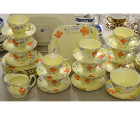 A Foley Art Deco floral printed thirty piece tea service including a jug, sugar bowl, cups, saucers; etc. pattern no V860E pr