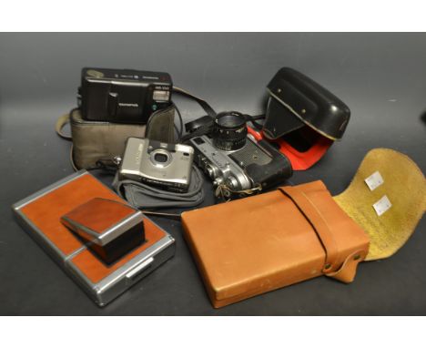Cameras - a USSR Zork; 4-K 35mm camera, cased; a Kodak Polaroid SX-70  camera cased; etc 