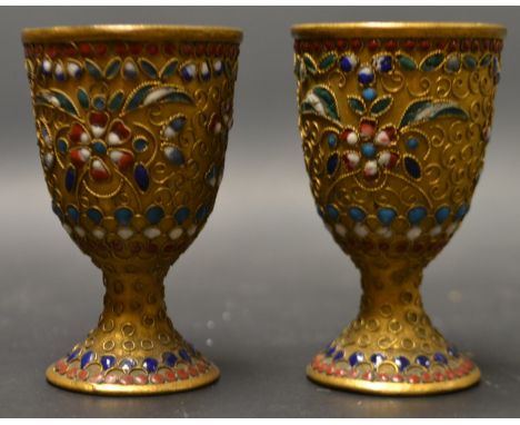 A pair Russian gilt and enamel vodka cups
