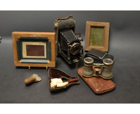 A carved meerschaum pipe, cased; a leather cigar case a Hedgehog pipe reamer; Agfa Bellows camera; Transvaal opera glasses; A
