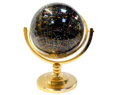 A Nightsky black agate celestial globe, set with mother of pearl, on a brass stand, 36cm high. 