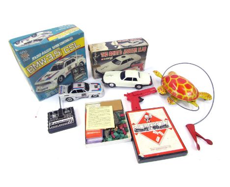 A Radio Racer radio controlled BMW 3.5 CSL car, together with a Corgi The Saint's Jaguar XJS, Monopoly part set, and a tinpla