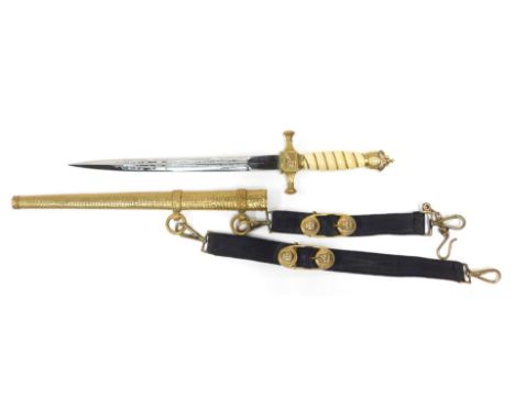 A German Imperial naval dirk, the open crown pommel above an ivorine grip interspersed with twisted brass wire, the brass hil