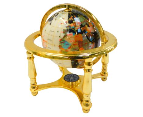 A hardstone set terrestial globe, in brass gimbal stand, the base set with a compass, 24cm high. 