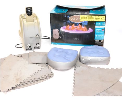 A Lay-Z-Spa 2-4 Bali Led hot tub and accessories, to include floor mat, canopy, chlorine, etc. 