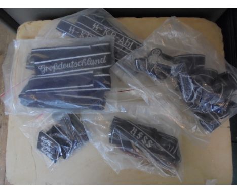 Large collection of armbands, insignia badges and lapel badges which relate to the German Army and the SAS.