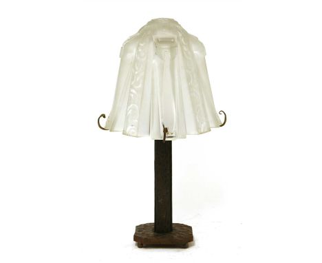 An Art Deco wrought iron table lamp, with a moulded glass shade, inscribed in the mould 'Muller Frères Lunéville' , 44cm high