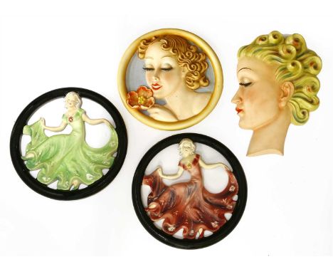 Two Goebel wall masks, each modelled as a lady with long eyelashes, one inscribed 'Specially designed by Mrs Agnes Richardson