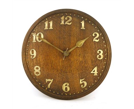 An Heal's oak convex wall clock, with brass Arabic numerals and a Zenith 18-day movement, labelled 'Reid &amp; Sons, Gem Buil