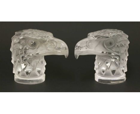 Two Lalique 'Tete d'Aigle' car mascots, originally designed in 1928, inscribed 'Lalique, France' . 11cm high (2)