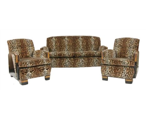 An Art Deco burr walnut and ebonised suite, comprising: a pair of armchairs, with modern leopard print upholstery, 72cm wide 