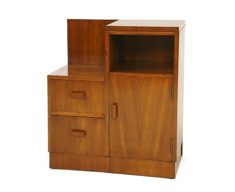 An Art Deco walnut bedside cabinet, with a shelf, two drawers and a cupboard, raised on a plinth, 66cm wide 35.5cm deep 76cm 