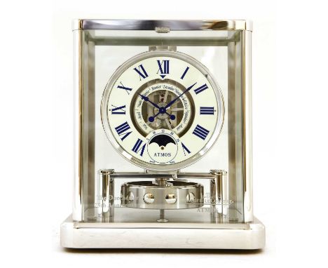 A Jaeger-LeCoultre 'Atmos' moonphase mantel clock, with a white enamel chapter ring, with Roman numerals with subsidiary cale