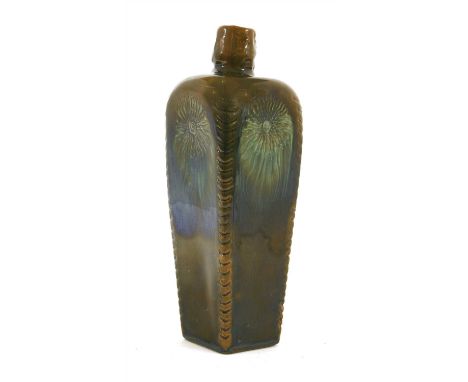 A Linthorpe Pottery bottle vase, c.1882-1883, of tapering form with a dark green glaze incised with flower heads, each traili