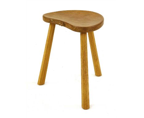 A Robert 'Mouseman' Thompson oak stool, the kidney-shaped seat, with the signature mouse , on three legs, 36.5cm wide 29cm de
