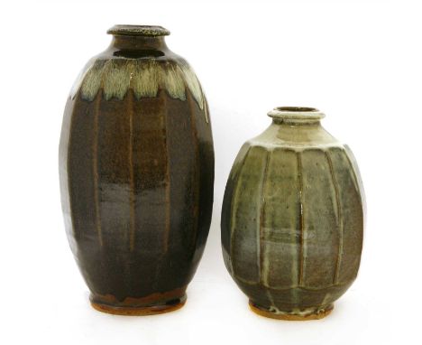 A Mike Dodd studio pottery vase, of faceted form with deep brown glaze, 34cm high, and another similar, 25cm high (2)