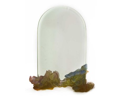 A Daum pâte de verre glass mirror, with a bevelled mirror plate and a shell moulded stand, signed to base, 33.5cm high