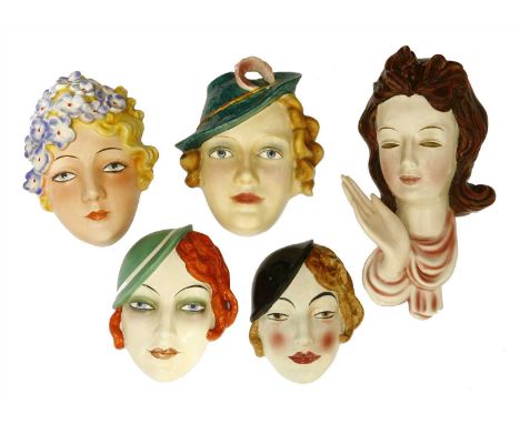 Five Art Deco pottery wall masks, two Goebel, one by Royal Belvedere, various marks, 26.5cm high (5)