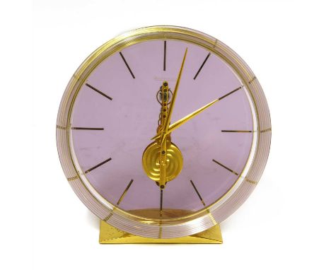 A Jaeger-LeCoultre perspex and gilt metal skeleton table clock, 20th century, with baton numerals, on a rectangular base, sta