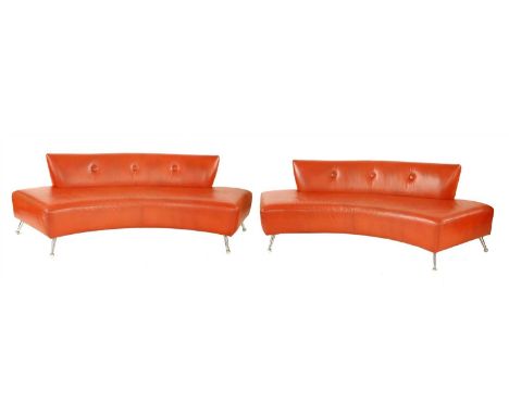 A pair of pink concave lounge settees, by Thayer Coggin, each with a low button back, raised on tapering chrome legs with bal