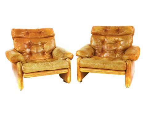 A pair of tan leather 'Coronado' armchairs, designed by Tobias Scarpa for C &amp; B Italia, with button backs and seats (2)