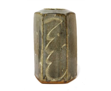 *Bernard Leach (1887-1979), an hexagonal tall vase, with a grey glaze with combed details, with studio repairs to firing crac