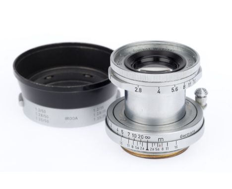 A Leitz Wetzlar Elmar f/2.8 5cm lens with IROOA Hood, silver, serial number 1450935, barrel G, optics G with some peripheral 