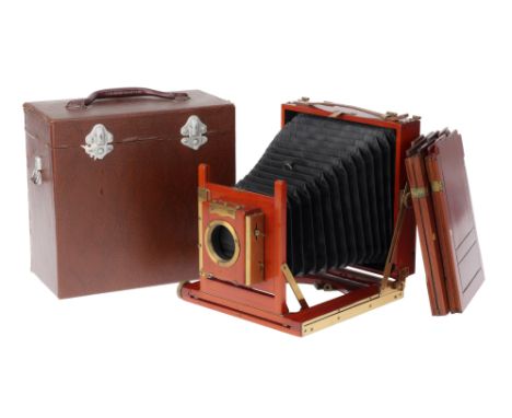 A Houghtons Ensign Victo 5x7 Inch Field Camera, mahogany and brass, VG, opens and closes correctly, ground glass intact, bell