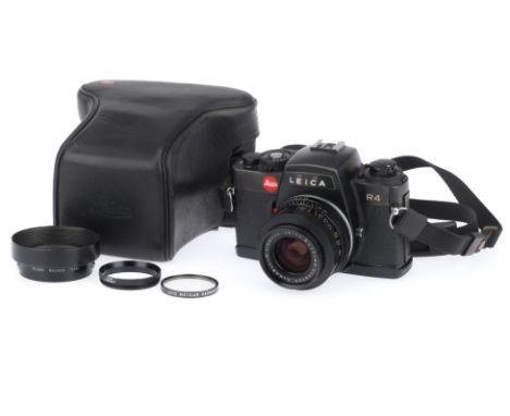 A Leica R4 SLR Camera, black, serial number 1609947, body G, some paint wear to bottom plate, shutter works, viewfinder displ