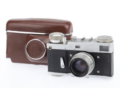 A Gomz Leningrad 4-screw model 35mm Rangefinder Camera, silver, serial number 643522, Latin lettering, body VG, motor drive w