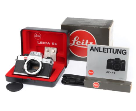 A Leica R4 Camera Body, black, serial number 1575566, body VG-E, appears to be very lightly used, shutter works, viewfinder d