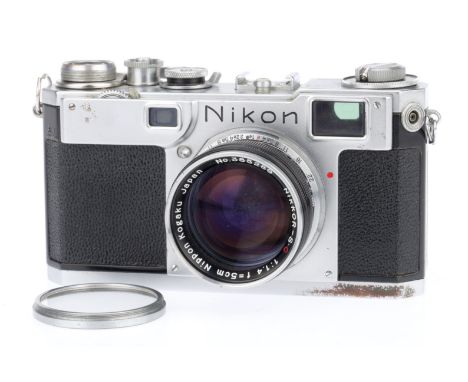 A Nikon S2 35mm Rangefinder Camera, silver, serial number 6180476, body F-G, wear marks and rubbing to top plate, rangefinder