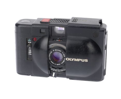 An Olympus XA Rangefinder Camera, black, body G, paint loss to battery cover, shutter working, rangefinder visible and workin