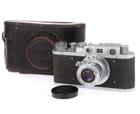 A FED 1g Rangefinder Camera, silver, serial number 659822, body G, shutter works well, rangefinder visible and working, with 