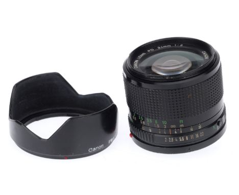 A Canon FD f/2 24mm Lens, black, serial number 10182, barrel G, optics P-F, with light dust, with hood