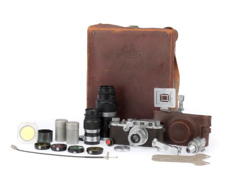 An Extensive Leica IIIa Rangefinder Camera Outfit, to include a Leica IIIa, serial number 184080, body G, shutter works but s