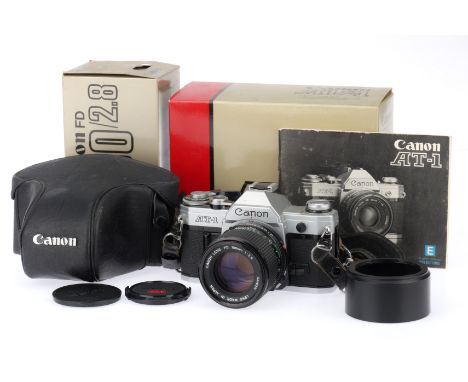 A Canon AT-1 35mm Camera, silver, serial number 419876, body G, not powering up, shutter not working, with maker's box, with 