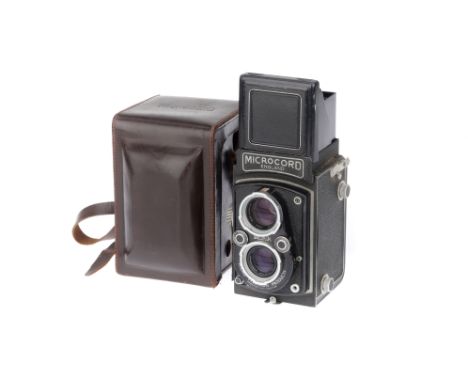 An M.P.P. Microcord II TLR Camera, black, serial number 10990, leatherette is loose in places, viewfinder works well, shutter