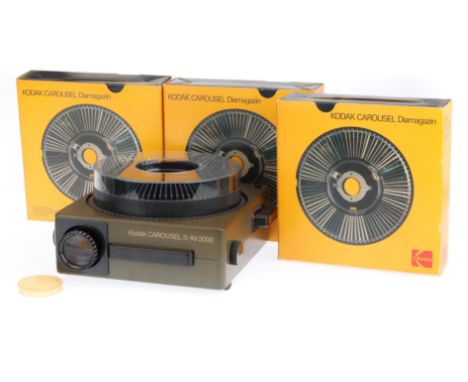 A Kodak S-AV2000 Slide Projector and Carousels, grey, body G, untested, with two light dimmer pug-in units, a controller and 