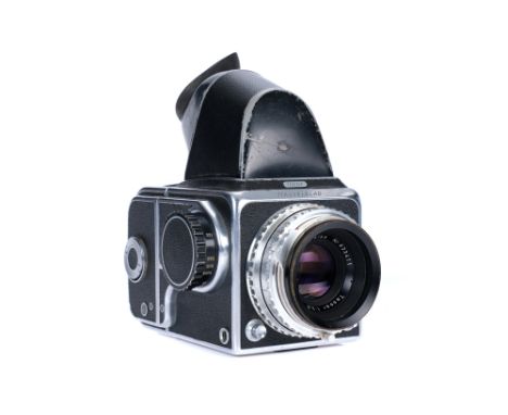A Hasselblad 1000F Medium Format Camera, 1957, chrome, serial no. CU22999, with Carl Zeiss Tessar f/2.8 80mm lens, chrome, se
