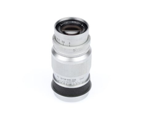 A Leitz Wetzlar Elmar f/4 9cm lens, sil, serial number 1497968, barrel VG, optics F-G with haze.
