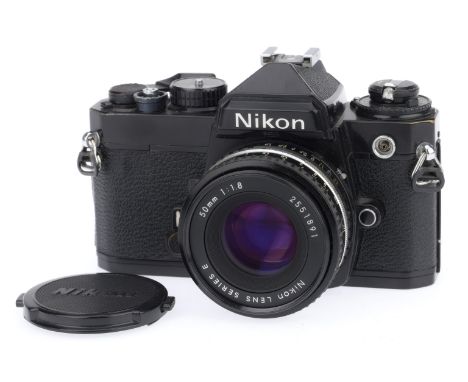 A Nikon FE 35mm SLR Camera, black, serial number 3183841, body G, shutter works but needs a second partial stroke to fire, li