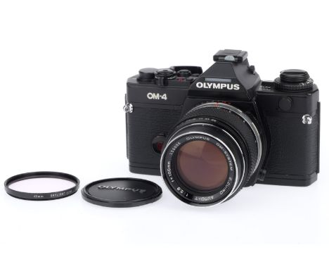An Olympus OM-4 35mm SLR Camera, black, serial number 1064867, body VG, shutter working on auto and manual, viewfinder displa