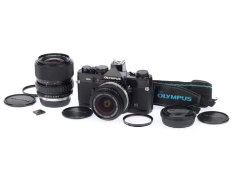An Olympus OM-2N MD 35mm SLR Camera Outfit, black, serial number 1138572, body VG-E, shutter works, meter responds, with a Zu