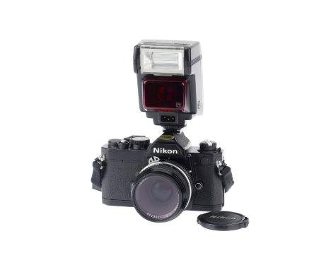A Nikon FM 35mm Film Camera, black, serial number 3351658, body VG, shutter works, meter responds to light, internal display 