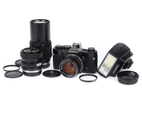 An Olympus OM-1 35mm SLR Camera Outfit, black, serial number 1268455, body G, some paint wear to prism cover, shutter works, 
