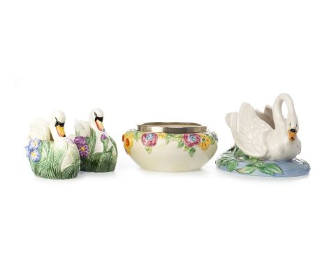 CLARICE CLIFF FOR WILKINSON BOWL, in the form of a swan modelled swimming amongst lily pads, 17cm high; along with a Clarice 